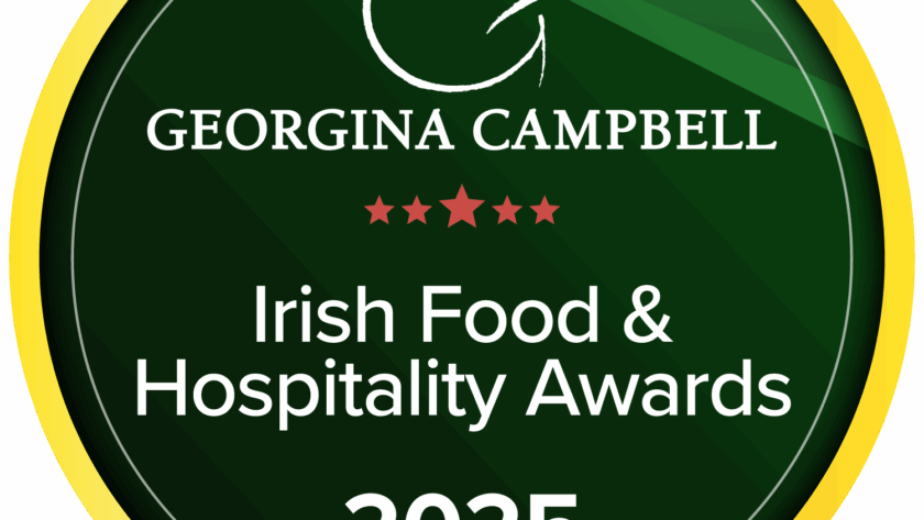 A circular green and gold badge with the text: "Georgina Campbell Irish Food & Hospitality Awards 2025" and five red stars in the centre.