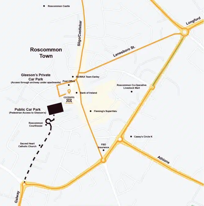 Map of Roscommon Town showing main roads, landmarks, car parks, Gleeson's restaurant, and key locations like the Sacred Heart Catholic Church, Fleming’s SuperValu, Roscommon Castle, and various shops.
